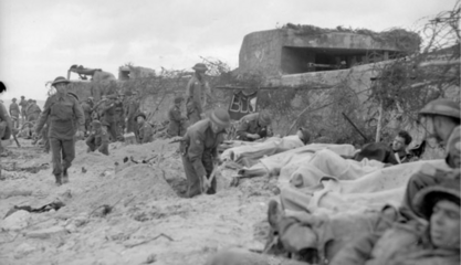 Wounded Canadian soldiers awaiting transfer to a Casualty Clearing Station of the Royal Canadian Army Medical Corps (R.C.A.M.C.) on D-Day, Courseulles-sur-Mer, France, 6 June 1944